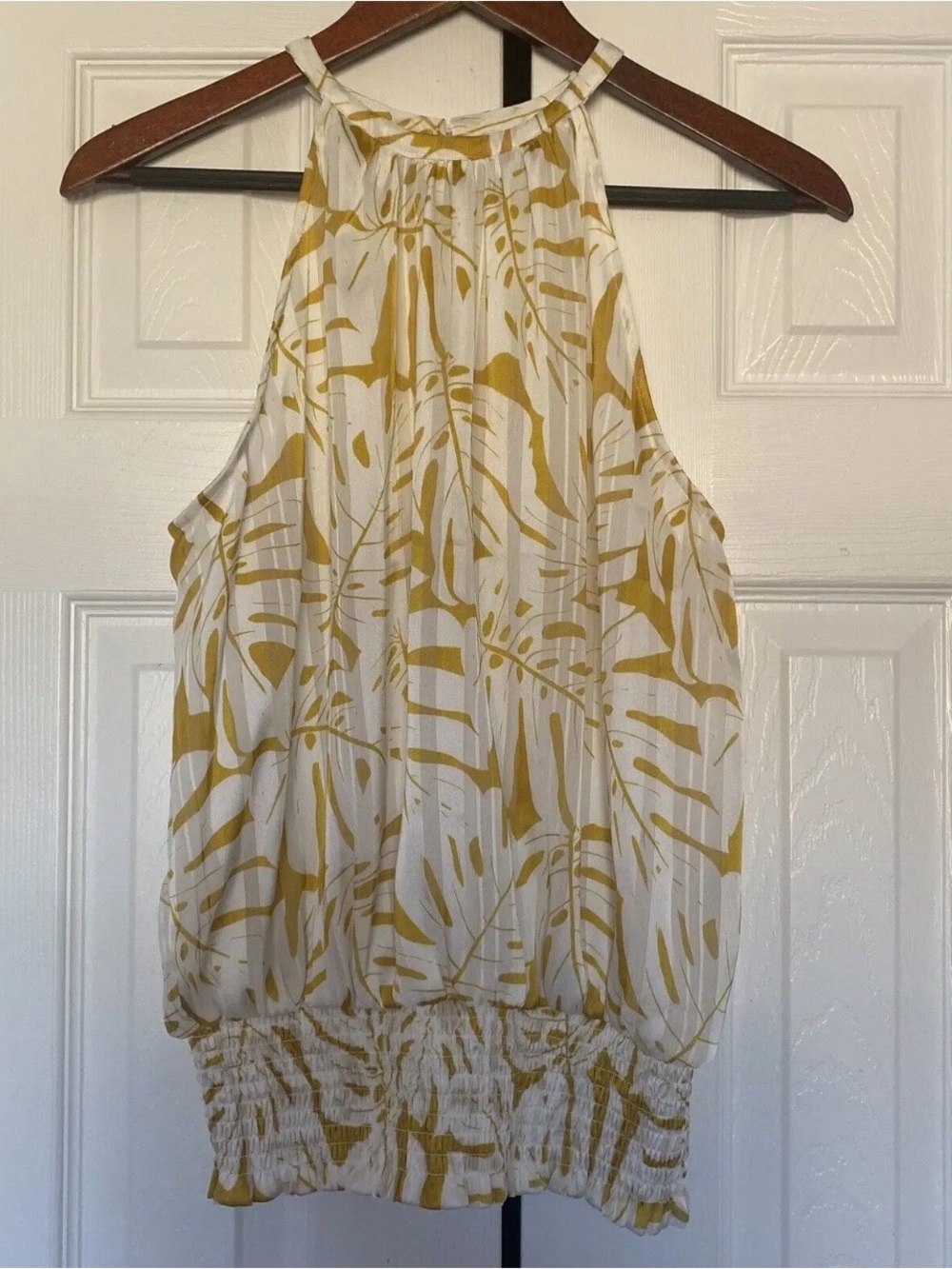 Joie yellow &white palm leaf print blouse with smocked waist & halter neckline.